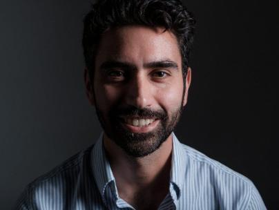 man with beard in striped shirt