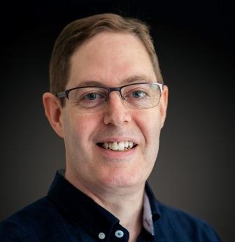 man in glasses and dark shirt