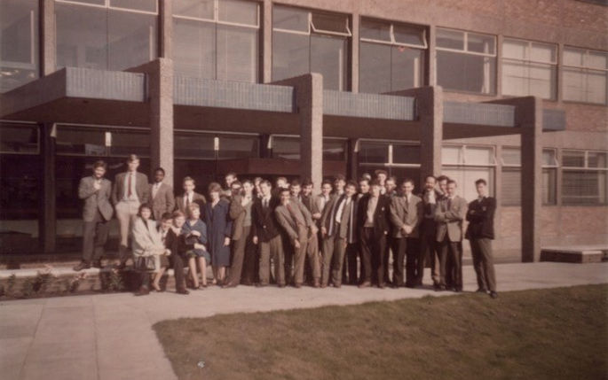 Class of 1961 outside a building 