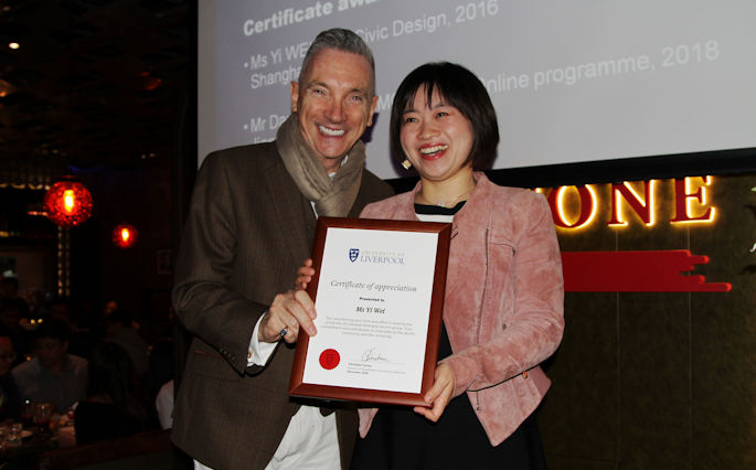 Gary Millar presenting volunteer with certificate