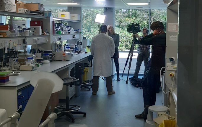 Photo of Professor Julian Hiscox being interviewed by BBC Newsnight in laboratory 