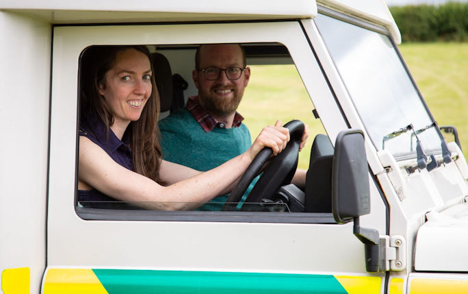 Alumnus Lawrence Dodi and partner Rachel Nixon sit in their converted ex ambulance ready to set off on their expedition 