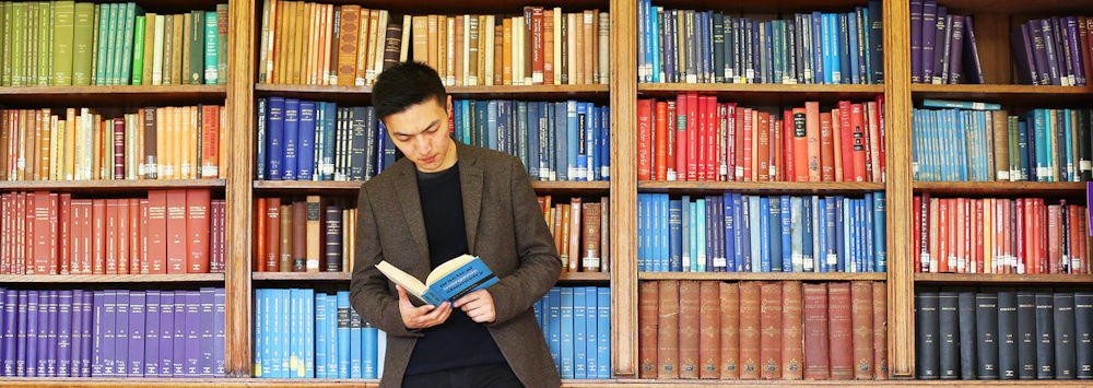 Postgraduate student in the School of the Arts library