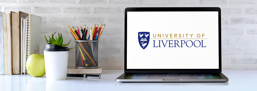 Laptop on a desk with University of Liverpool logo