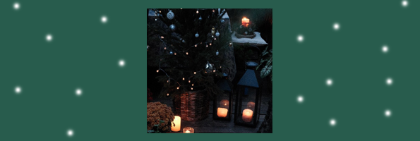 Image of candles near a Christmas tree