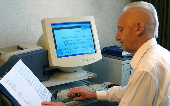 Alumnus Alan Jones composing on his computer