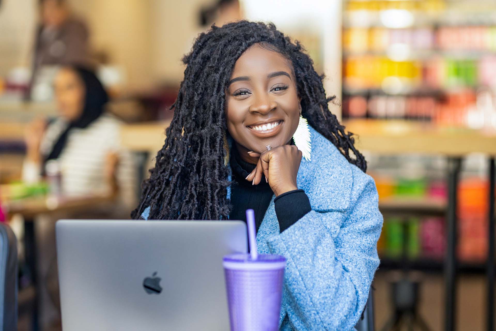 Image of person in front of a laptop