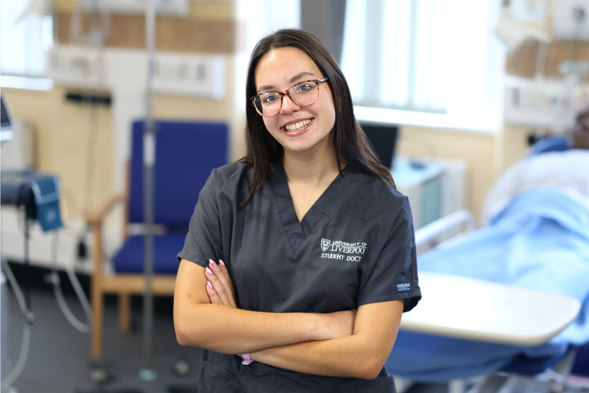 Image of a student in scrubs