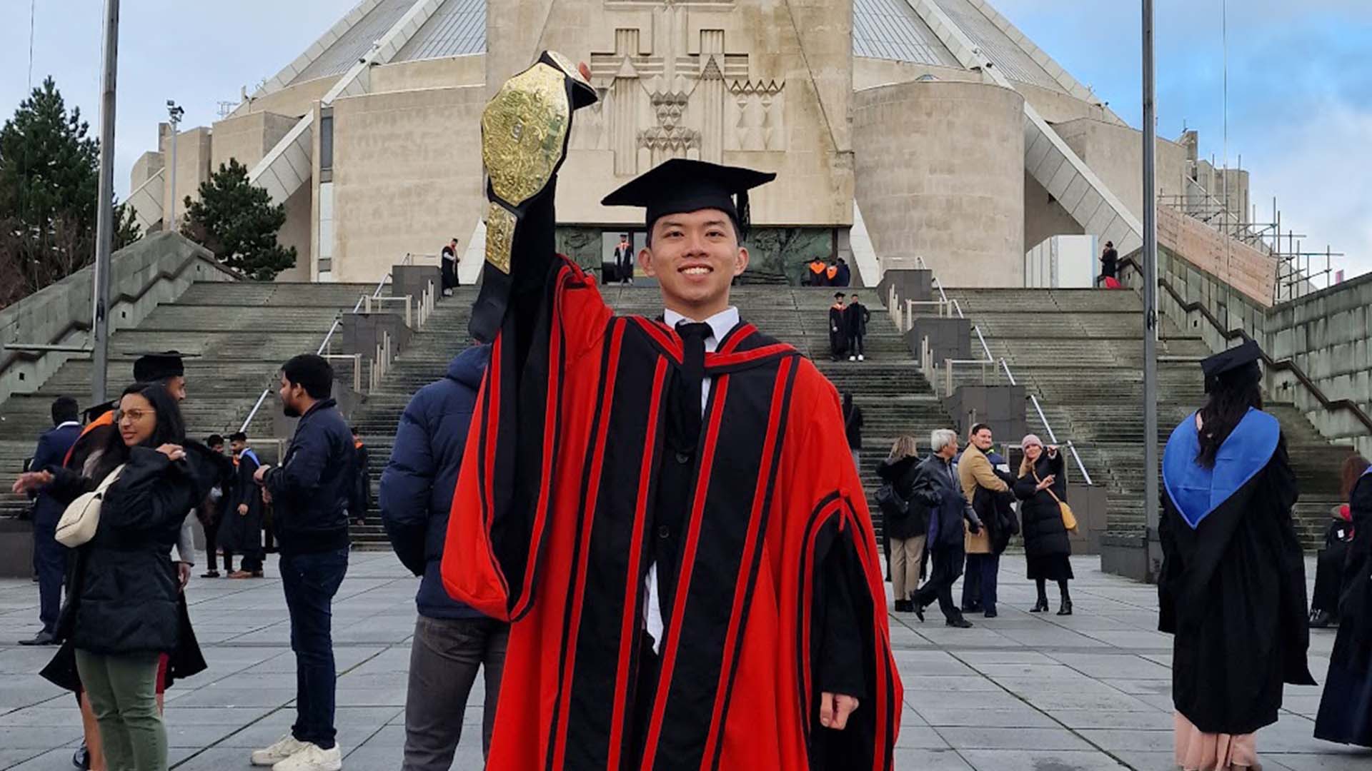 Graduate posing for a photo