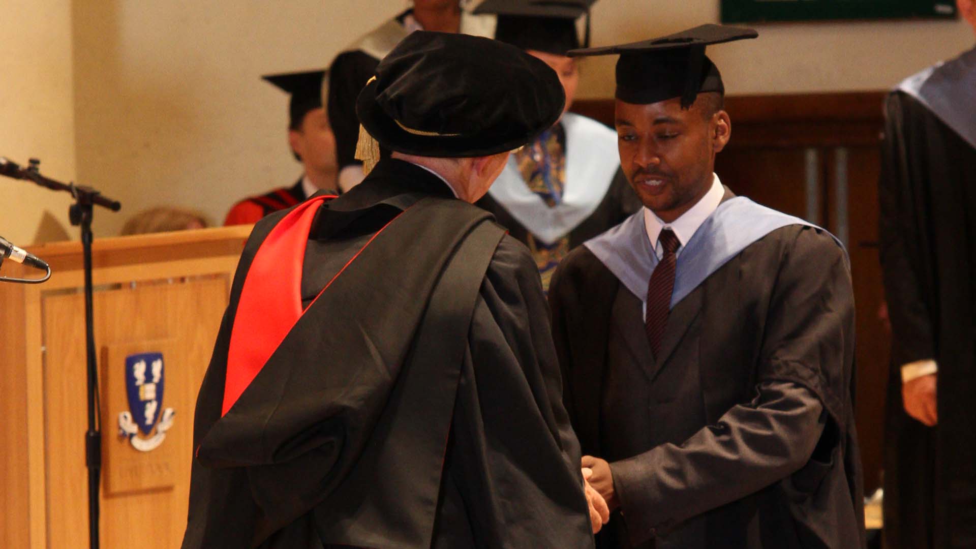 Graduate walking across the stage