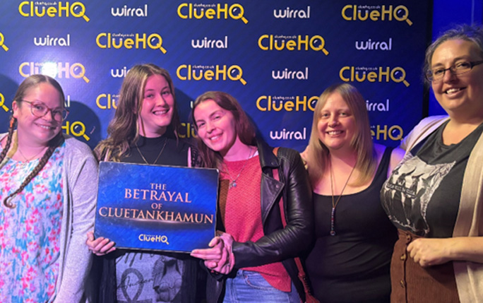 group of people pose with a certificate