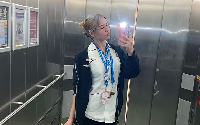 Person in a lift in a hospital taking a selfie