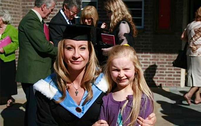 A mother and daughter pictured on the mother's graduation day