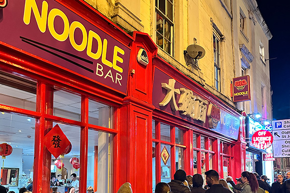 Restaurant with people queuing outside