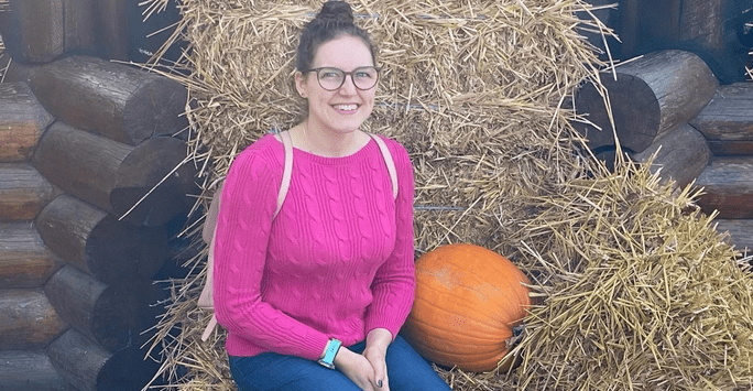 Kaylea Clark posing with a pumpkin