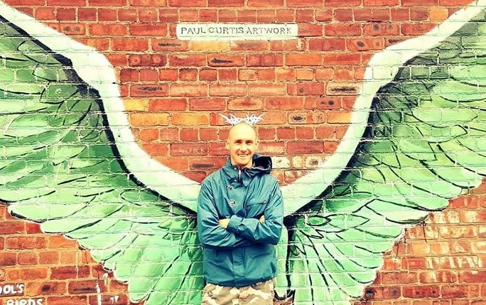Paul Curtis in front of his Baltic Triangle street art piece.