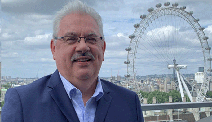 Image of Peter Geraghty with the London Skyline behind him