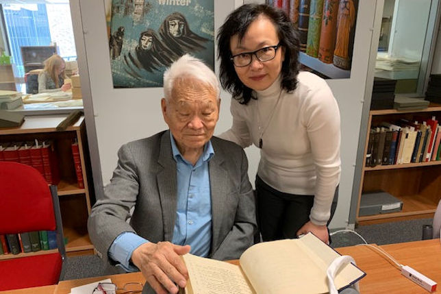 Professor Xue and his daughter reading through his Father's work from the 1930's