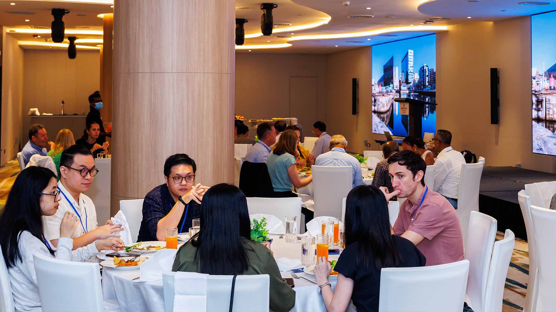 Group of people sit down for dinner at an event