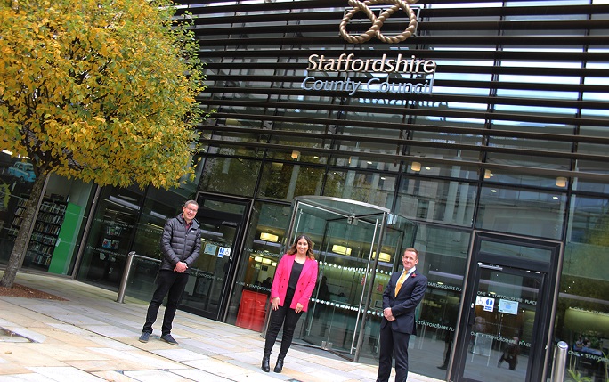 Alumni Tom, Lily and Alan stand in front of the Staffordshire County Council Headquarters