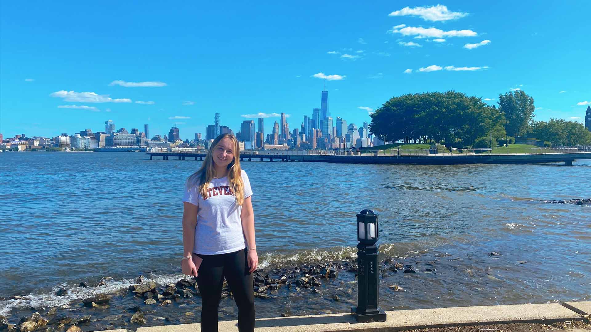 Image of person in front of the New York skyline