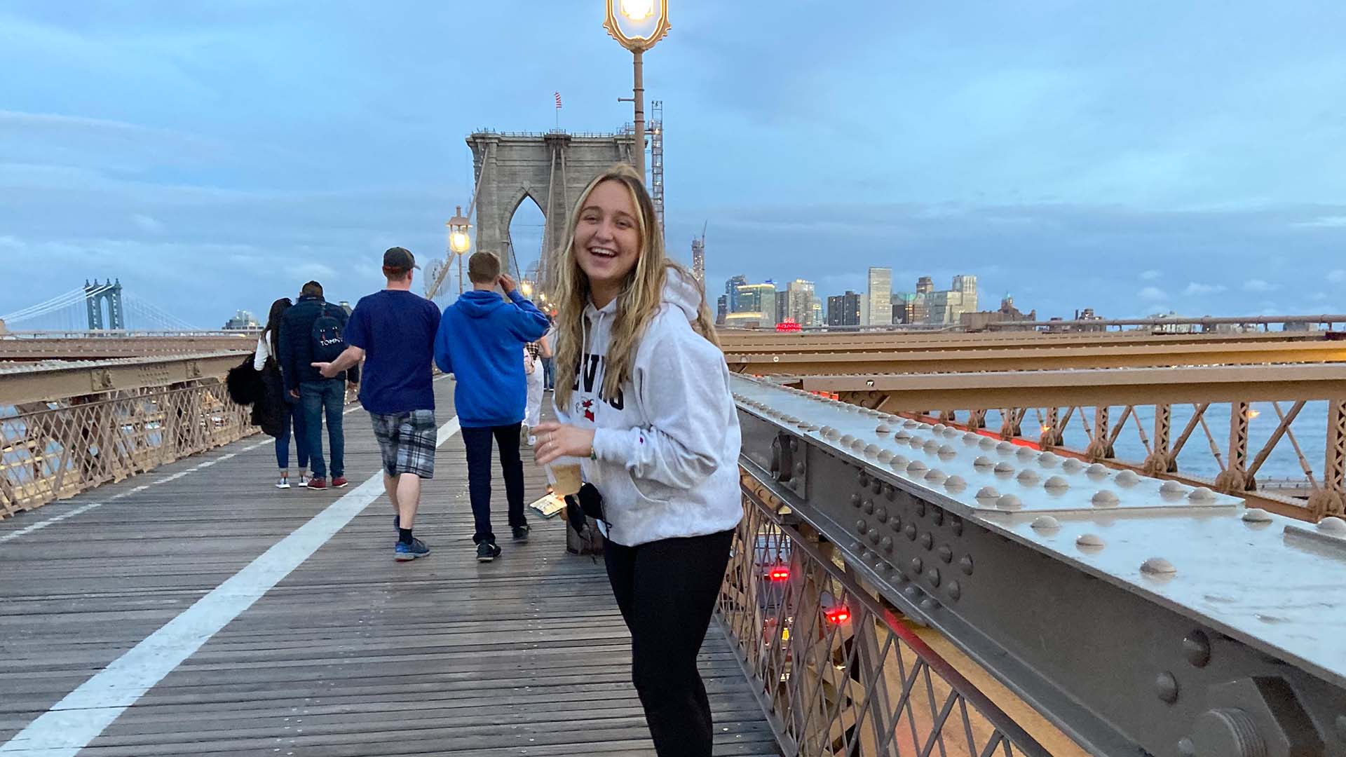 Image of someone on a bridge with the skyline in the background