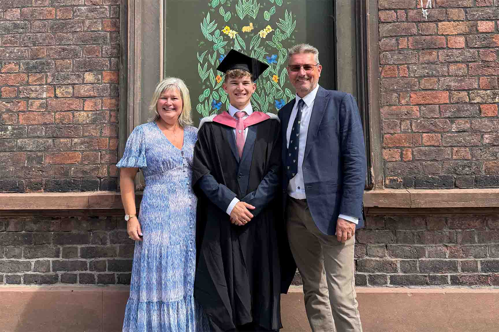 graduate with their family