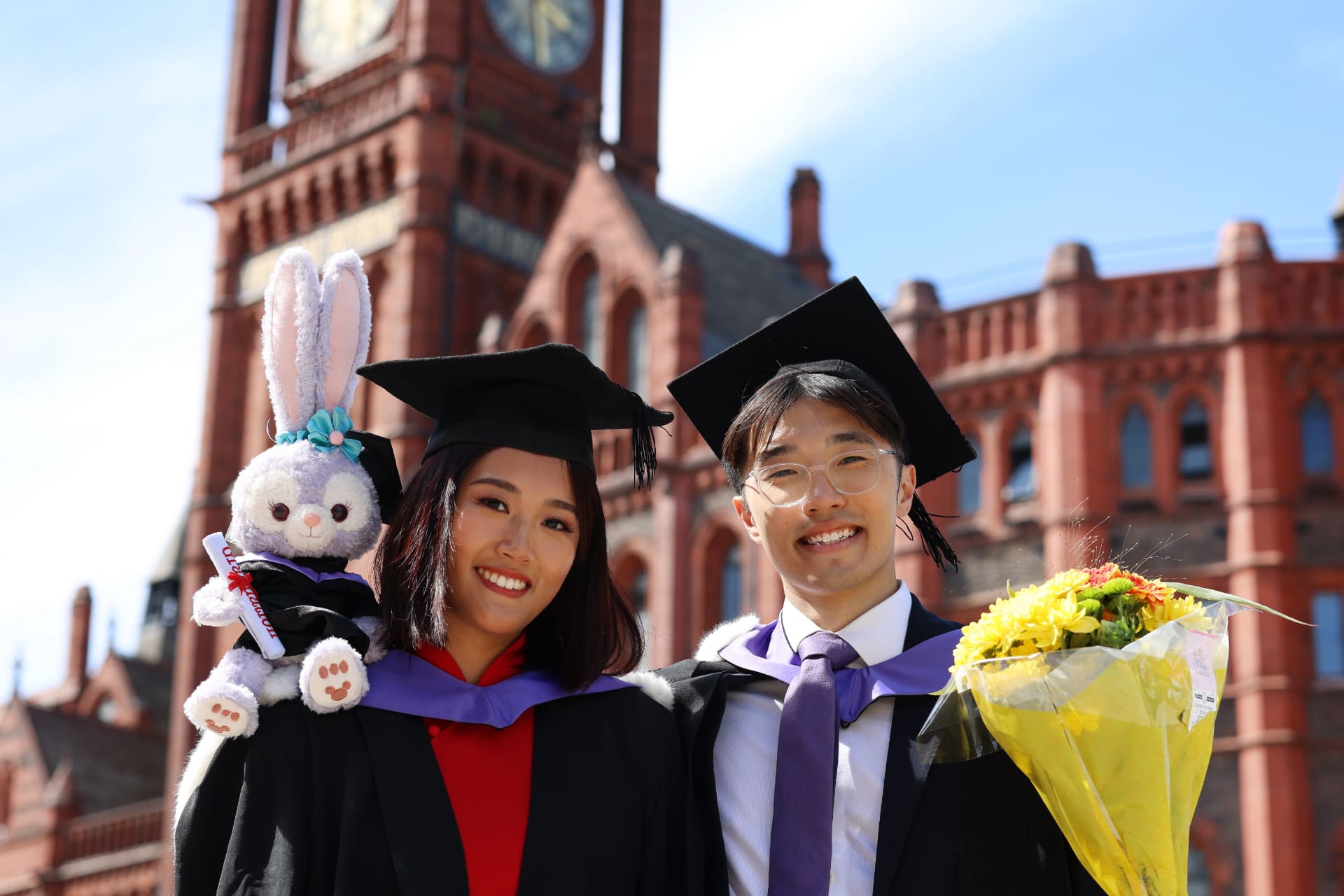 Two graduates on the University Square at the University of Liverpool