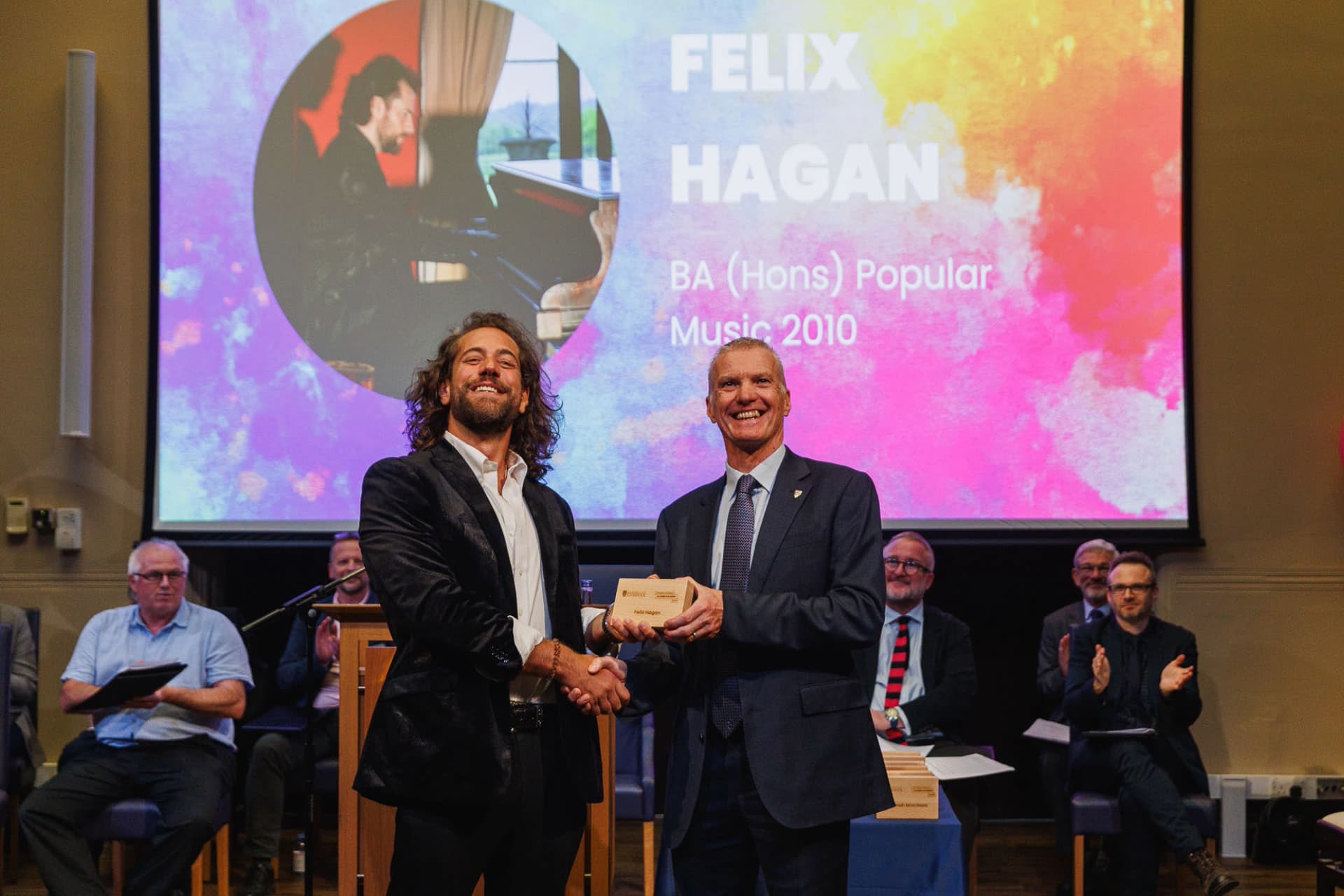 Image of person accepting an award