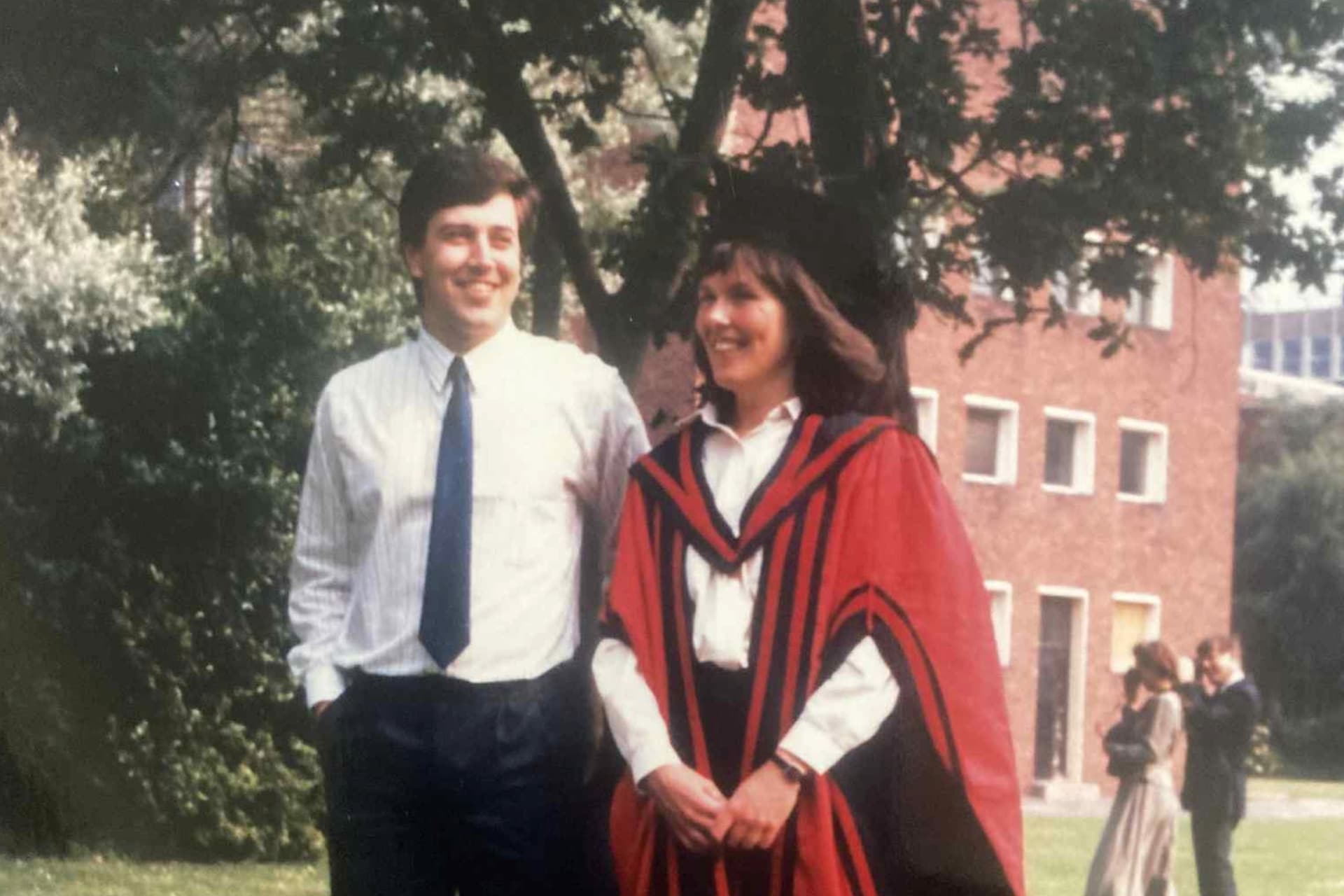 Two people at a graduation