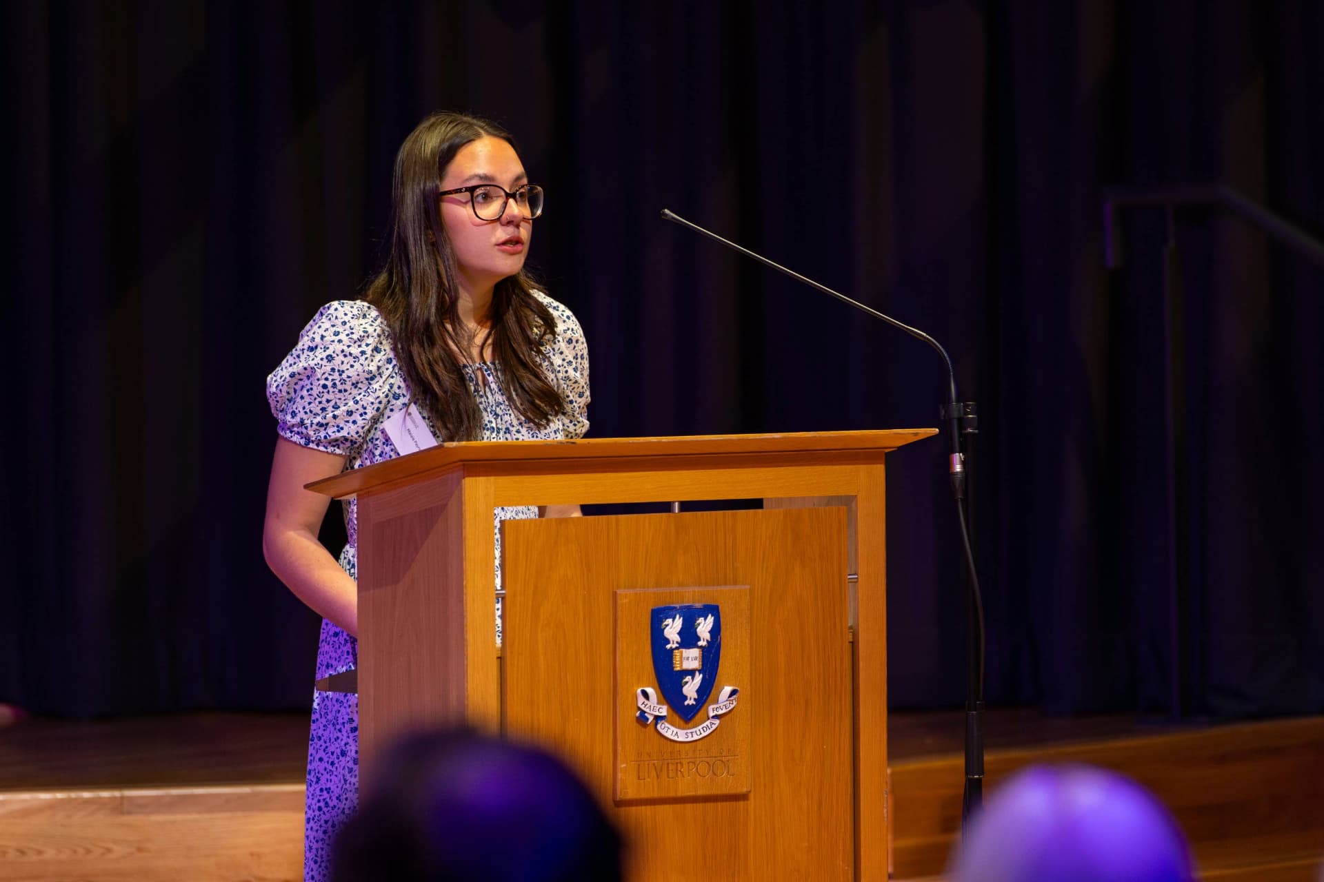 Student giving a talk at an event