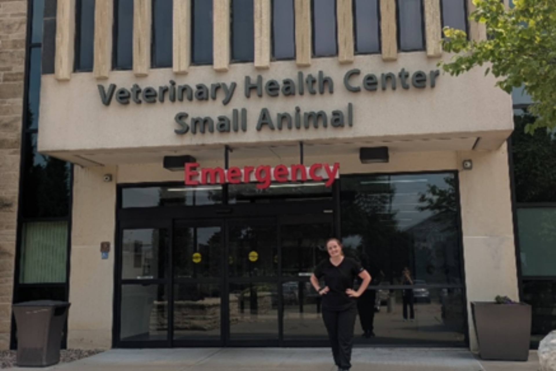 Image of a person in front of a building
