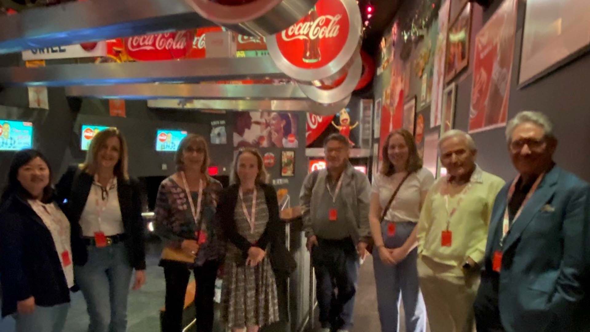 Group of people on a tour pose for a photo