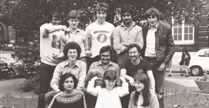 black and white image of a group of university students pose in a group