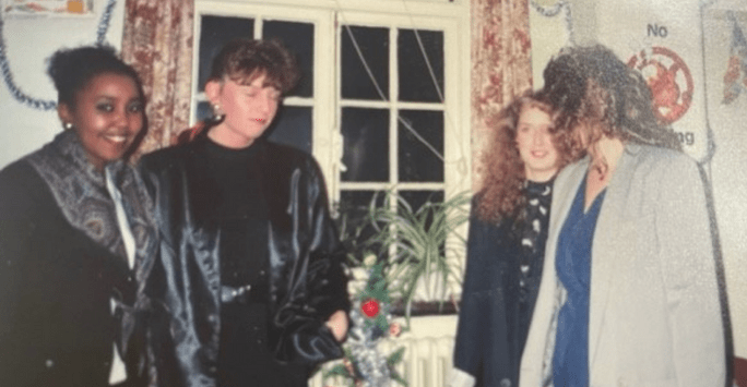 a group of friends wearing fashionable clothes in the 1980s